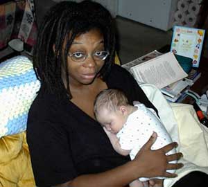 Chey holding newborn Lila