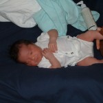 Newborn Eva on bed