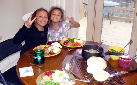 Lila and Eva wishing you peace on Thanksgiving, 2009.