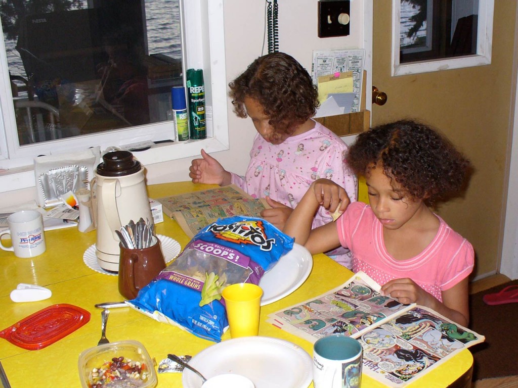 Reading comic books at a table