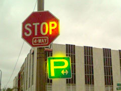 "P" for Parking sign in Owosso, MI. The P is pulled out of proportion.